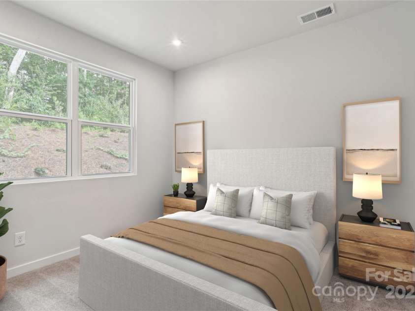 9305 Munsing Drive, Charlotte, NC 28269.  MLS# CAR4254319, YatesRealty ID 31629. *Virtually staged representative of the Norman floorplan – not the actual home* Spacious loft and second living area overlooking the stunning 2-story great room.