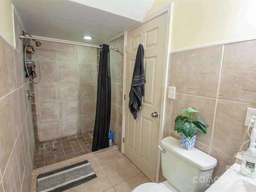 2540 Heritage Circle, Statesville, NC 28625.  MLS# CAR4246736, YatesRealty ID 31639. Full walk-in shower basement bathroom