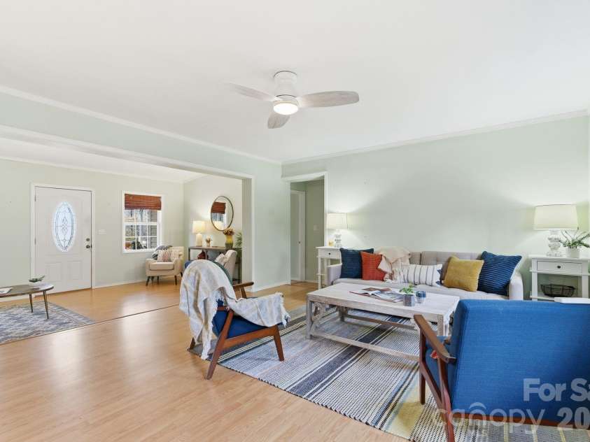 72 Lacey Lane, Hendersonville, NC 28739.  MLS# CAR4308230, YatesRealty ID 3164. Living Room (looking towards main entrance and primary bedroom/den wing)