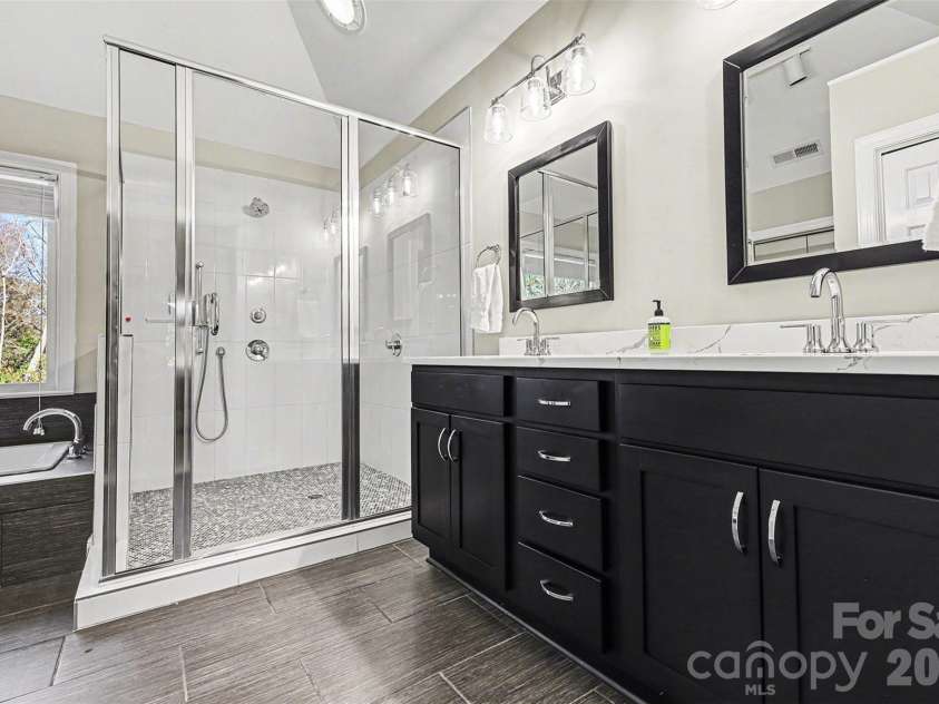 9908 Colvard Circle, Charlotte, NC 28269.  MLS# CAR4332495, YatesRealty ID 3164. Renovated Primary Bath