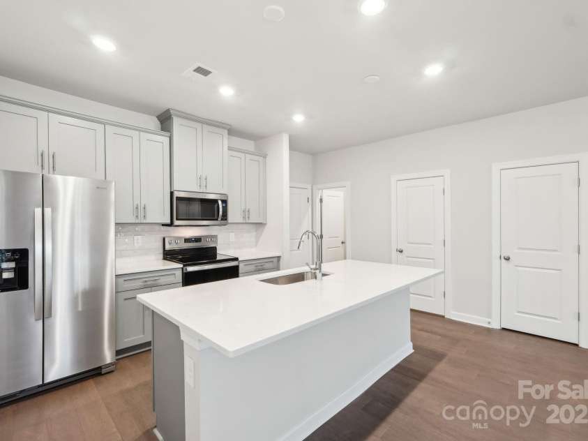 125 UTILITY Lane, Mooresville, NC 28117.  MLS# CAR4286424, YatesRealty ID 31643. Photo is not of the actual home, but is an inspirational photo of builder’s model home and may depict options, furnishings, and/or decorator features that are not included