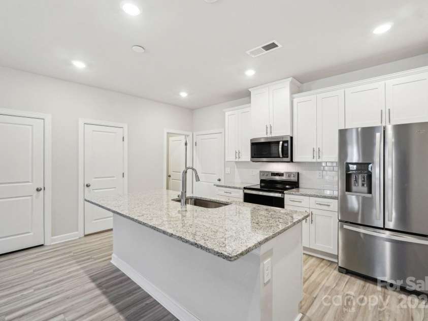 125 UTILITY Lane, Mooresville, NC 28117.  MLS# CAR4286425, YatesRealty ID 31643. Photo is not of the actual home, but is an inspirational photo of builder’s model home and may depict options, furnishings, and/or decorator features that are not included