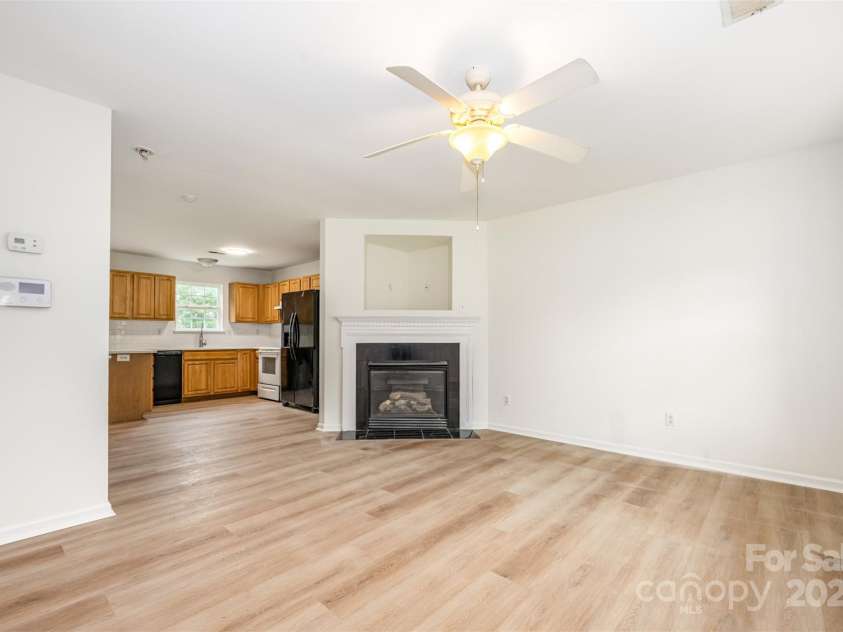 1413 Braveheart Lane, Charlotte, NC 28216.  MLS# CAR4290480, YatesRealty ID 31645. Living Room w/ gas fireplace