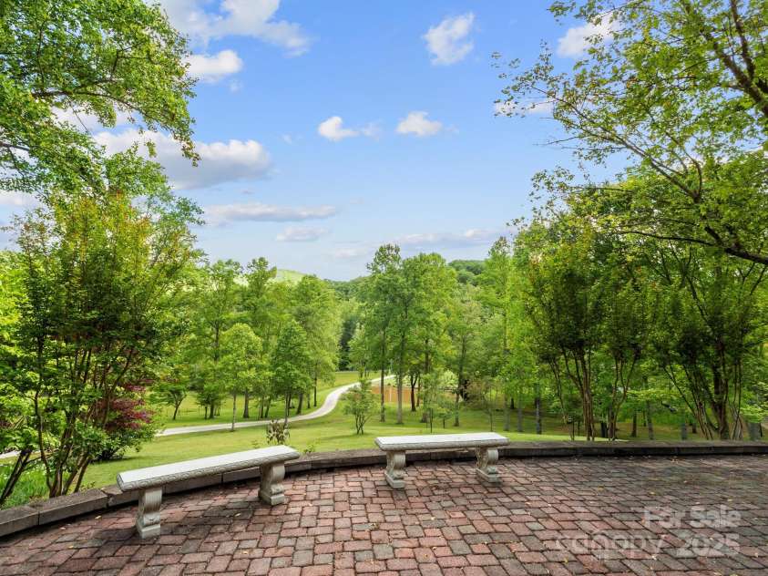 116 Sams Branch Road, Candler, NC 28715.  MLS# CAR4137587, YatesRealty ID 3165. Admire your grounds from the patio