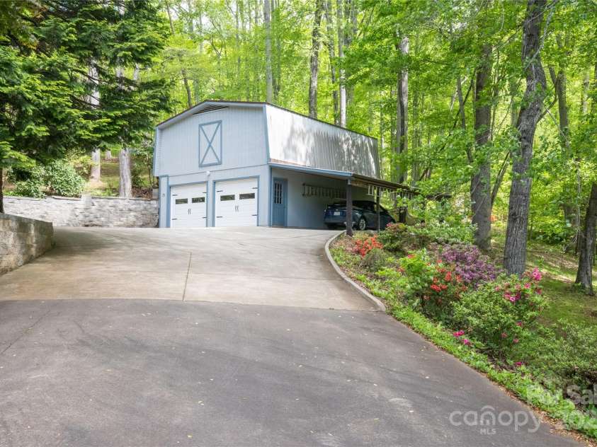 116 Sams Branch Road, Candler, NC 28715.  MLS# CAR4137587, YatesRealty ID 3165. Huge detached garage with storage 