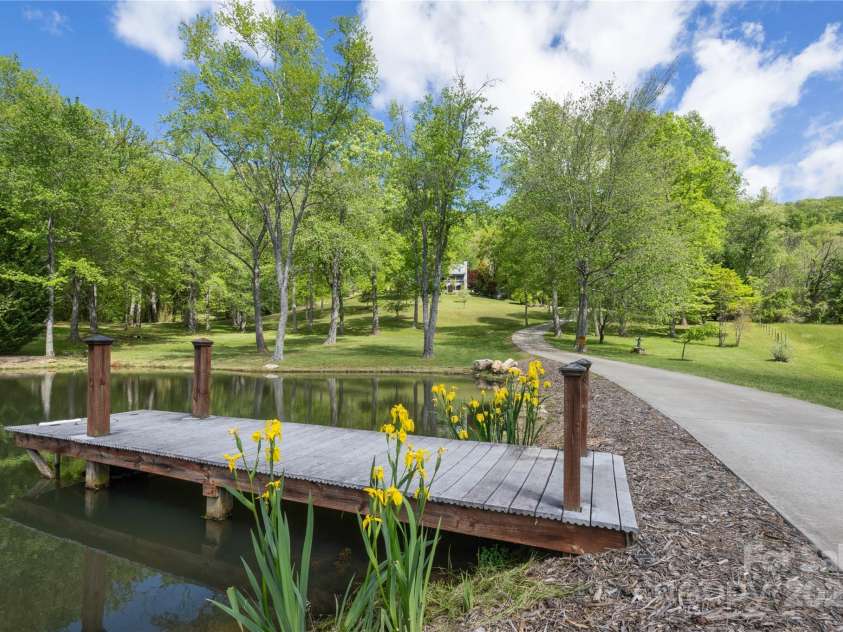 116 Sams Branch Road, Candler, NC 28715.  MLS# CAR4137587, YatesRealty ID 3165. Large stocked pond near  entry to property 
