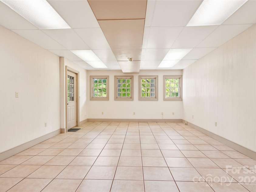 116 Sams Branch Road, Candler, NC 28715.  MLS# CAR4137587, YatesRealty ID 3165. Outside entrance for flex room/ art studio