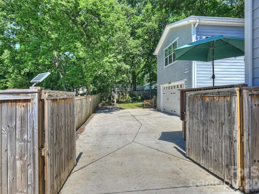 1617 Hawthorne Lane, Charlotte, NC 28205.  MLS# CAR4383885, YatesRealty ID 31657. Automatic gate over the driveway