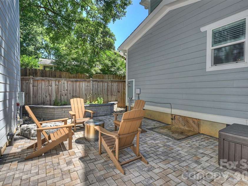 1617 Hawthorne Lane, Charlotte, NC 28205.  MLS# CAR4383885, YatesRealty ID 31657. Paver Patio with Fire Pit area