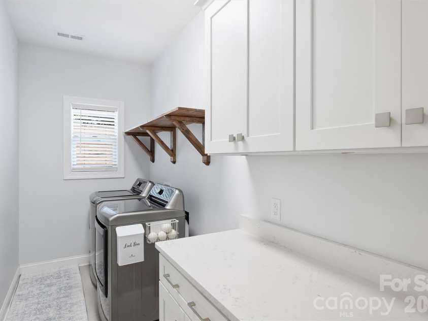 1617 Hawthorne Lane, Charlotte, NC 28205.  MLS# CAR4383885, YatesRealty ID 31657. Upstairs Laundry