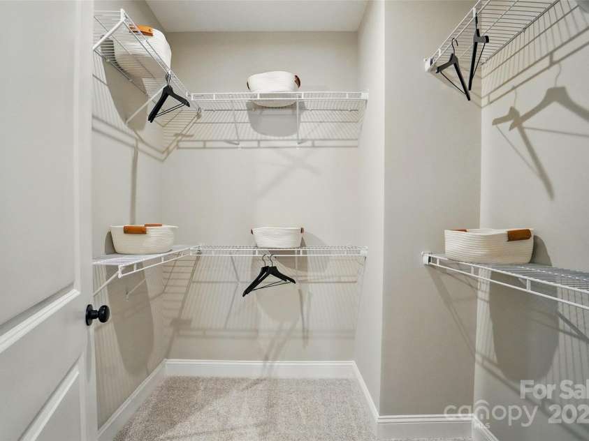 12051 Lavinia Lane, Charlotte, NC 28277.  MLS# CAR4257366, YatesRealty ID 31665. Representation only of Primary closet in bath