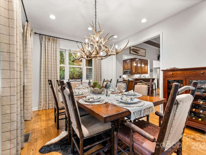 16 Hemlock Way, Highlands, NC 28741.  MLS# CAR4286772, YatesRealty ID 31668. Formal Dining Room, nestled conveniently off the kitchen and living room, with doors leading to the back deck and screen porch.