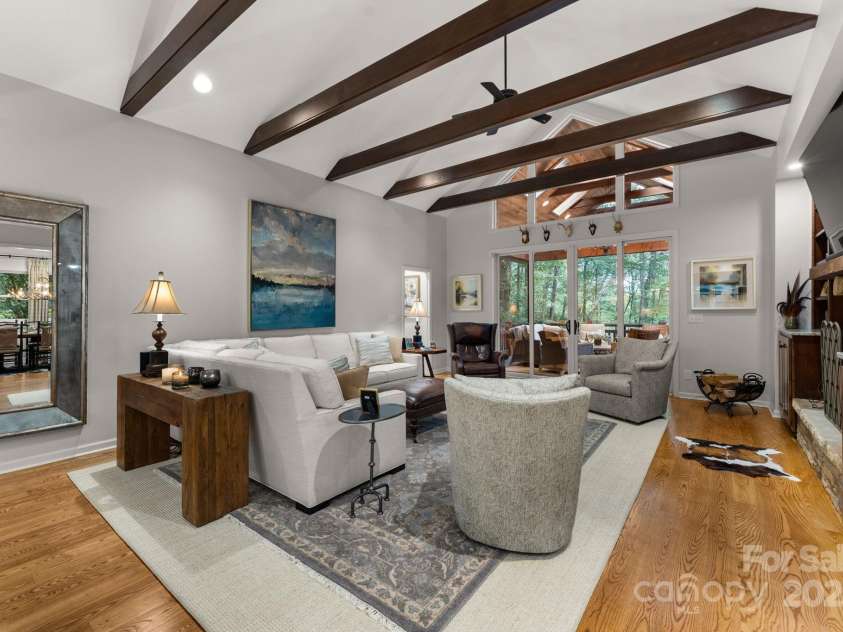16 Hemlock Way, Highlands, NC 28741.  MLS# CAR4286772, YatesRealty ID 31668. Great Room with Fireplace & Soaring Beamed Ceiling