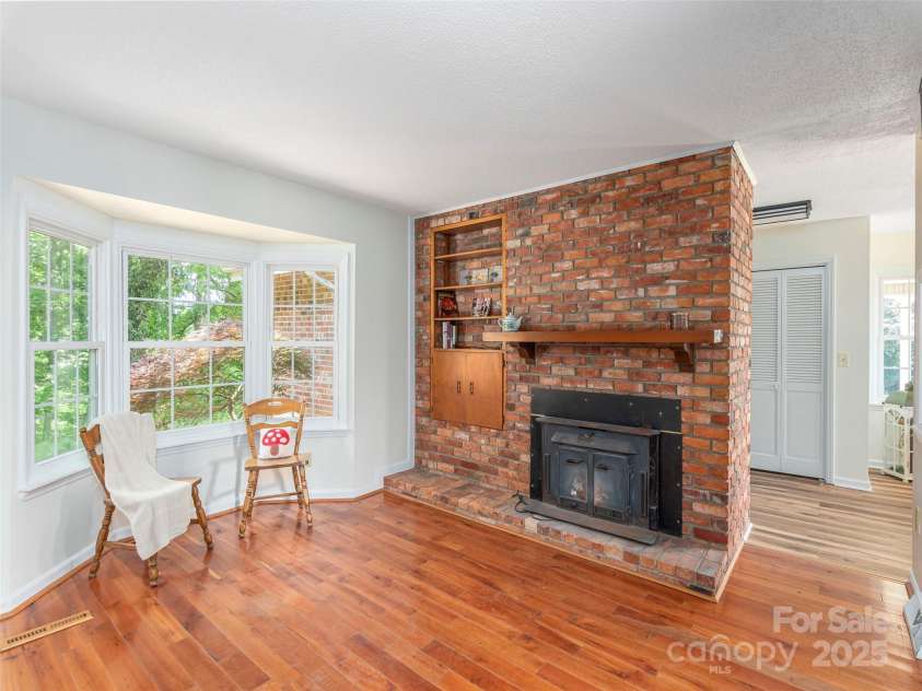 80 Gobblers Knob Drive, Clyde, NC 28721.  MLS# CAR4272798, YatesRealty ID 31672. Keeping room or library or whatever you want this cozy room to be