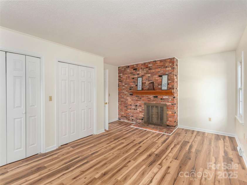 80 Gobblers Knob Drive, Clyde, NC 28721.  MLS# CAR4272798, YatesRealty ID 31672. Primary bedroom is on its wing of the home