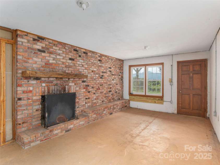 80 Gobblers Knob Drive, Clyde, NC 28721.  MLS# CAR4272798, YatesRealty ID 31672. Recreation room in the basement with fireplace