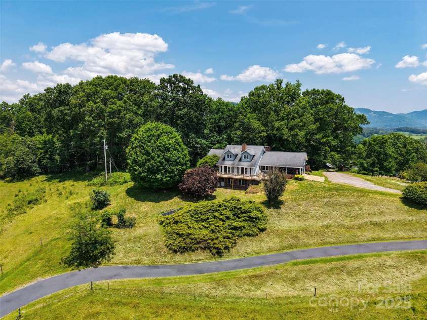 80 Gobblers Knob Drive, Clyde, NC 28721.  MLS# CAR4272798, YatesRealty ID 31672. Sits on a natural knob, 10 minutes from Waynesville