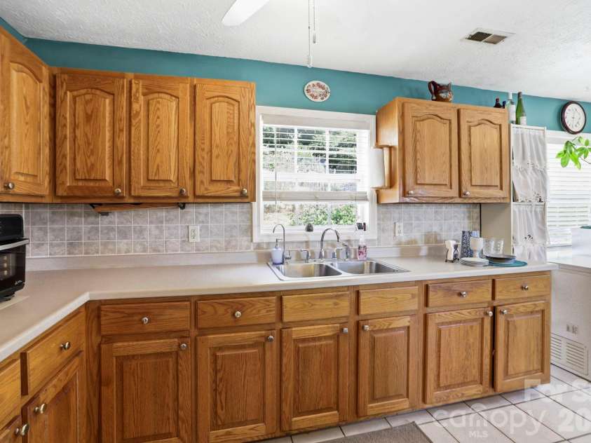 658 Enka Lake Road, Candler, NC 28715.  MLS# CAR4395073, YatesRealty ID 31676. 