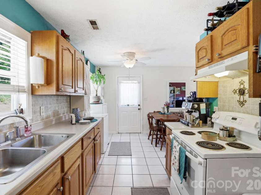 658 Enka Lake Road, Candler, NC 28715.  MLS# CAR4395073, YatesRealty ID 31676. 