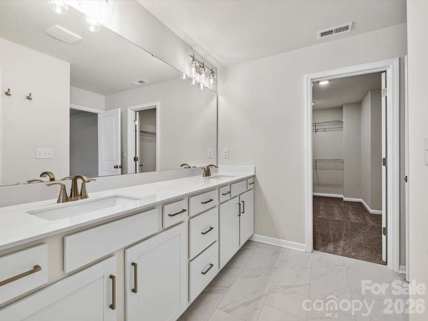 280 Alluvium Lane, Waxhaw, NC 28173.  MLS# CAR4371531, YatesRealty ID 31678. Laundry room with folding table