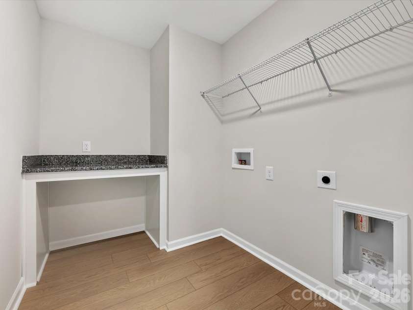 280 Alluvium Lane, Waxhaw, NC 28173.  MLS# CAR4371531, YatesRealty ID 31678. Laundry room with folding table