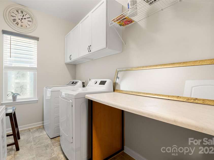 23174 Goose Down Lane, Lancaster, SC 29720.  MLS# CAR4286603, YatesRealty ID 31688. Laundry - with cabinets and folding table