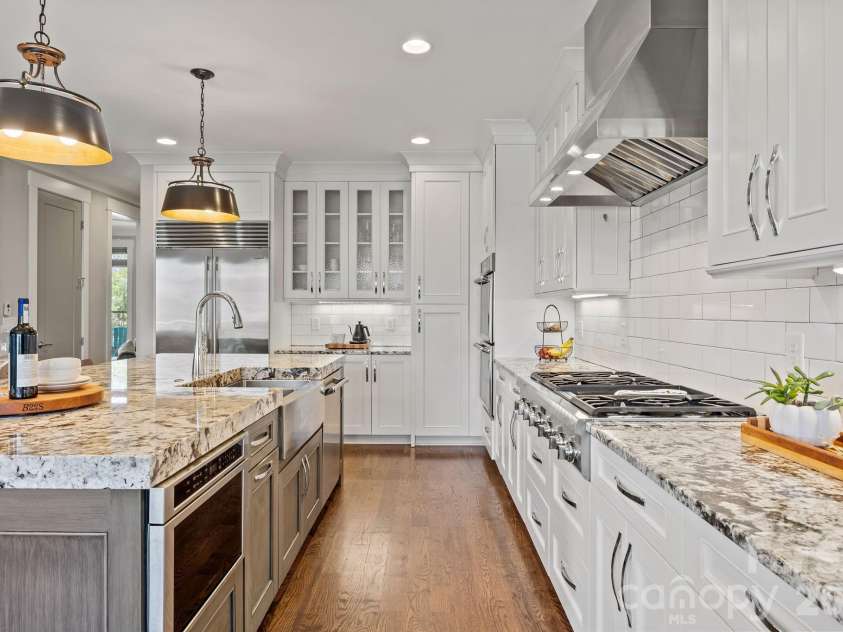22304 John Gamble Road, Cornelius, NC 28031.  MLS# CAR4353501, YatesRealty ID 3169. 6 burner gas range stove with hood