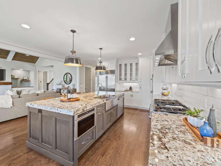 22304 John Gamble Road, Cornelius, NC 28031.  MLS# CAR4353501, YatesRealty ID 3169. Kitchen w/ large island opens to the great room