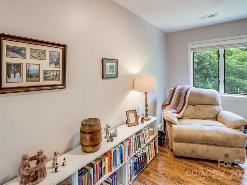 200 Crescent Drive, Lake Junaluska, NC 28745.  MLS# CAR4286284, YatesRealty ID 31693. Cozy sitting room is located off upper Primary Bedroom with a door to bath and one to large walk-in closet.