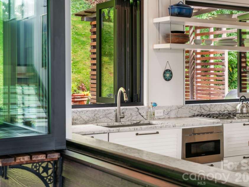 53 Buchanan Place, Asheville, NC 28801.  MLS# CAR4386804, YatesRealty ID 31695. Kitchen windows slide open to bring the outside in