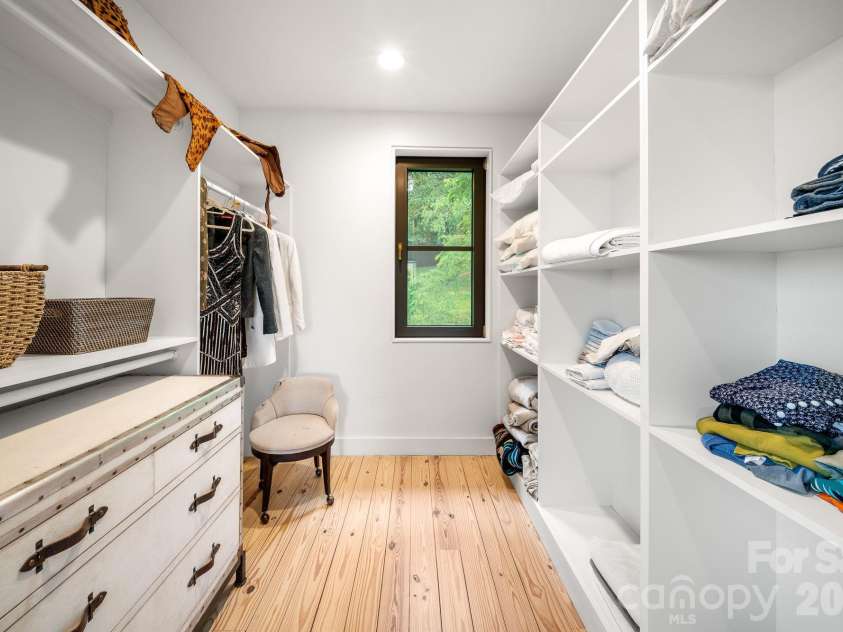 53 Buchanan Place, Asheville, NC 28801.  MLS# CAR4386804, YatesRealty ID 31695. Open closet with shelving and racks makes getting dressed a breeze