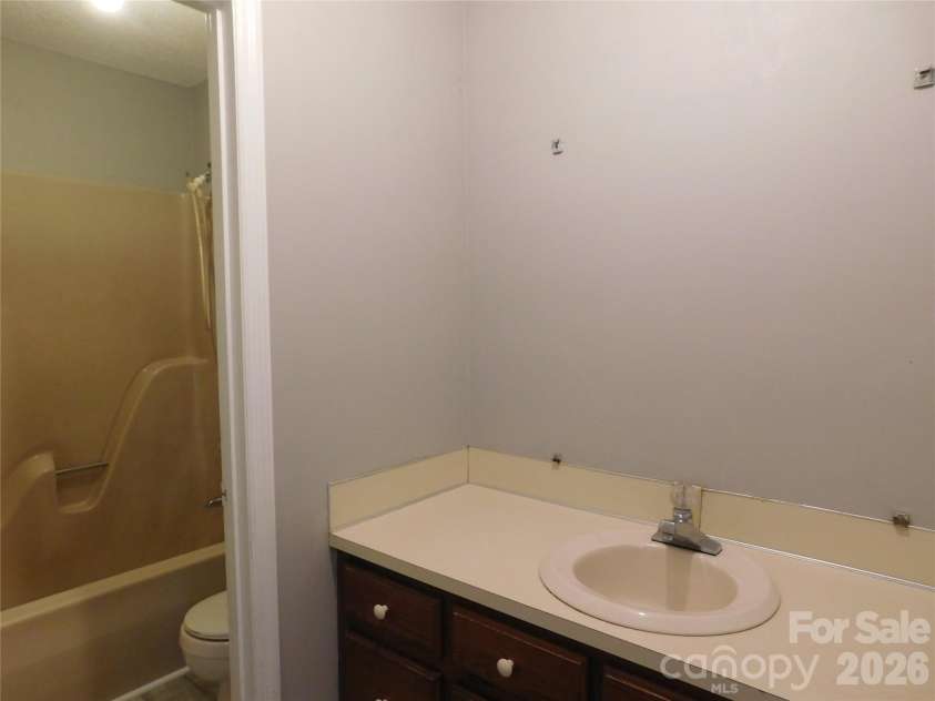 5509 Morgan Mill Road, Monroe, NC 28110.  MLS# CAR4343983, YatesRealty ID 3170. Hall bathroom