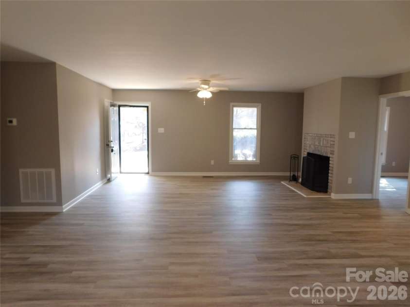 5509 Morgan Mill Road, Monroe, NC 28110.  MLS# CAR4343983, YatesRealty ID 3170. View from dining area toward front door