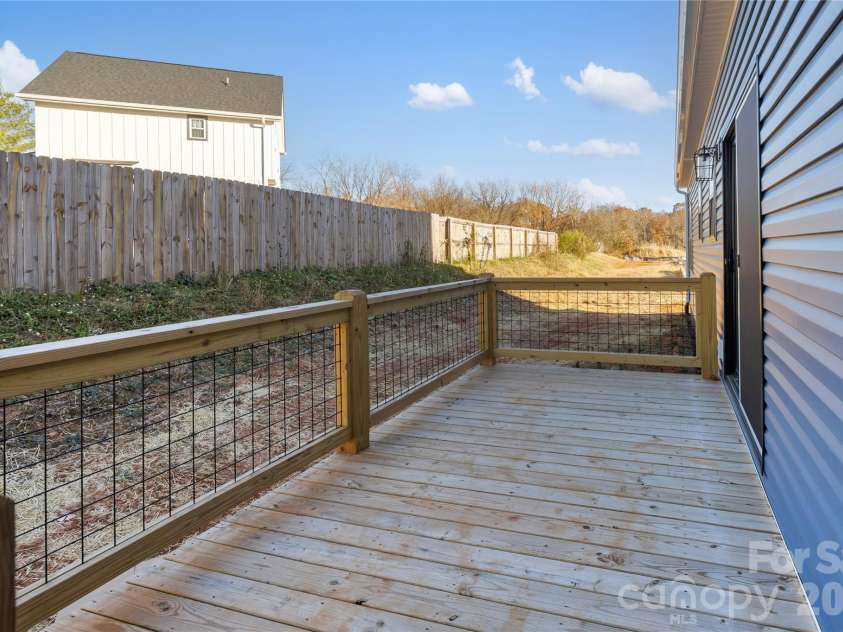 204 Southern Charm Road, Arden, NC 28704.  MLS# CAR4329406, YatesRealty ID 3171. Large deck off Dining Room 