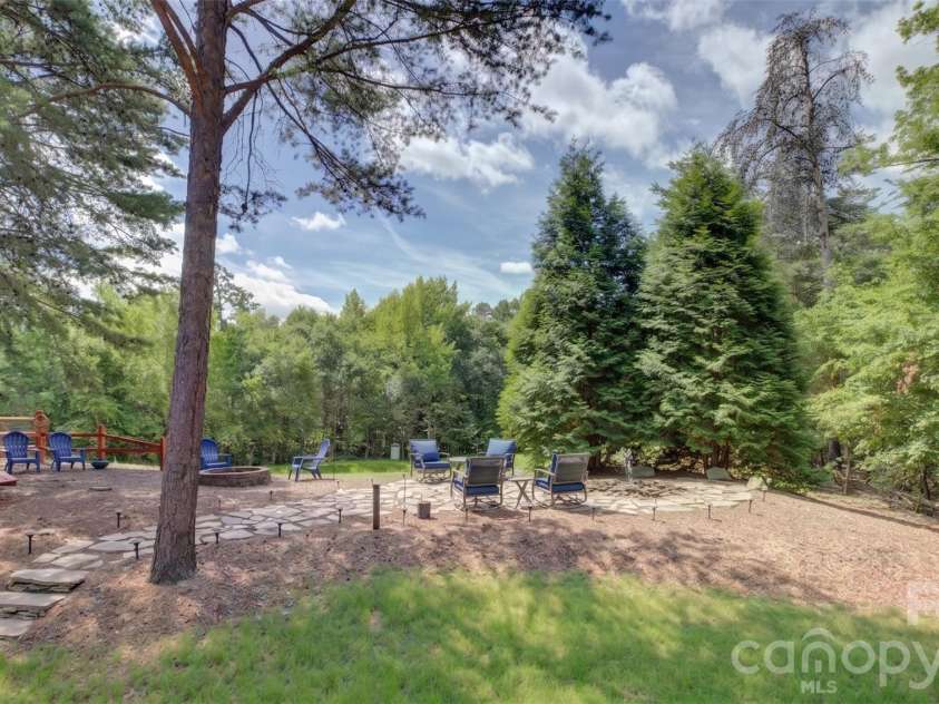 9609 Spurwig Court, Charlotte, NC 28278.  MLS# CAR4392336, YatesRealty ID 31710. Spacious backyard featuring a private oasis with professional landscaping and ample room for outdoor relaxation.