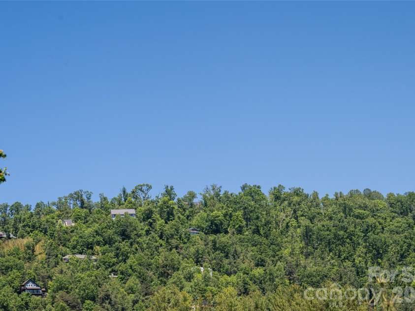 1 Beaverdam Knoll Road, Asheville, NC 28804.  MLS# CAR4382855, YatesRealty ID 31734. Mountain view from front yard