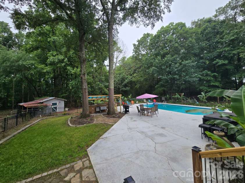 205 Dornoch Drive, Weddington, NC 28104.  MLS# CAR4384055, YatesRealty ID 31736. Backyard Pool/Patio
