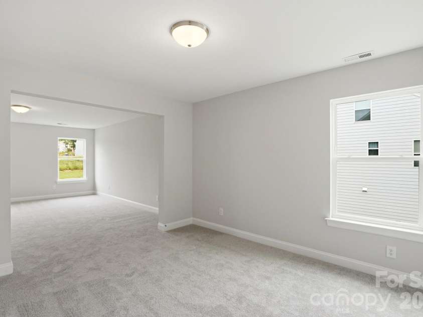 5917 New River Drive, Huntersville, NC 28078.  MLS# CAR4359977, YatesRealty ID 31748. Sitting Room in Primary Bedroom