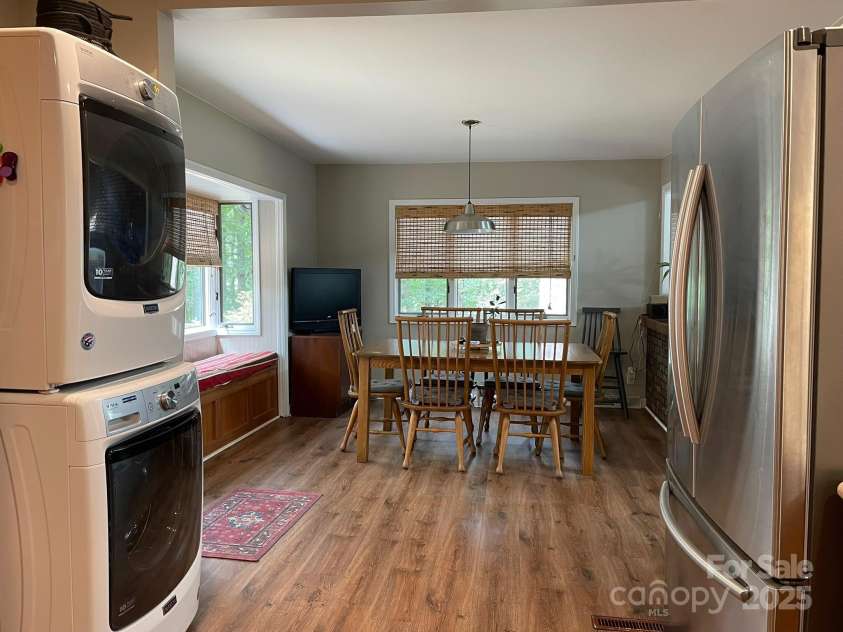 5434 Beckhaven Lane, Charlotte, NC 28216.  MLS# CAR4330987, YatesRealty ID 3175. Kitchen with stackable washer dryer and fridge