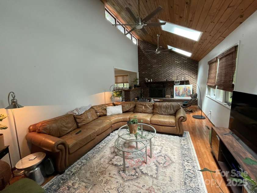 5434 Beckhaven Lane, Charlotte, NC 28216.  MLS# CAR4330987, YatesRealty ID 3175. Step Down Family Room with Fireplace and Skylights