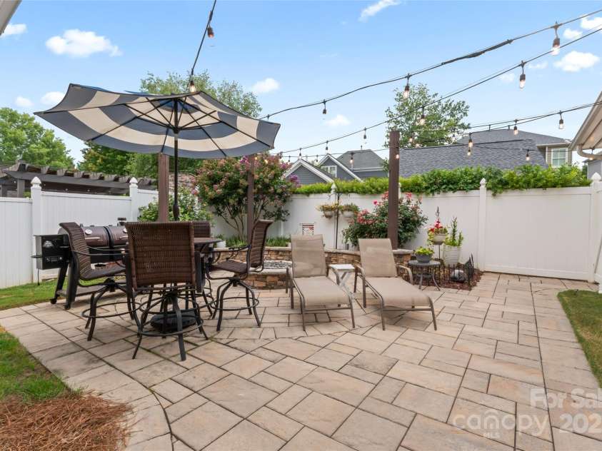 878 Promenade Walk, Fort Mill, SC 29708.  MLS# CAR4281286, YatesRealty ID 31755. Your back patio with paver stones, fire pit and grass area!