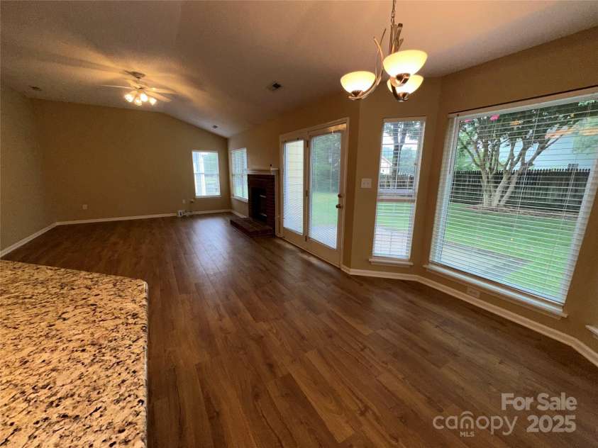 5416 Hedgecrest Place, Charlotte, NC 28269.  MLS# CAR4287168, YatesRealty ID 31760. Dining Area view of Great Room & Backyard