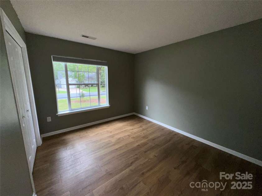 5416 Hedgecrest Place, Charlotte, NC 28269.  MLS# CAR4287168, YatesRealty ID 31760. Front Bedroom #2 with double door closet