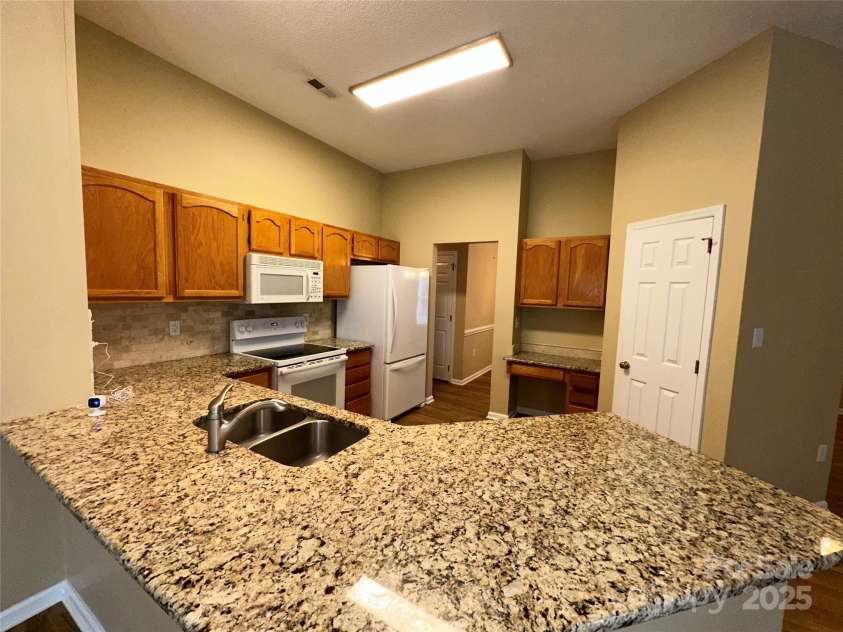 5416 Hedgecrest Place, Charlotte, NC 28269.  MLS# CAR4287168, YatesRealty ID 31760. Refrigerator, dishwasher, stove & microwave remain