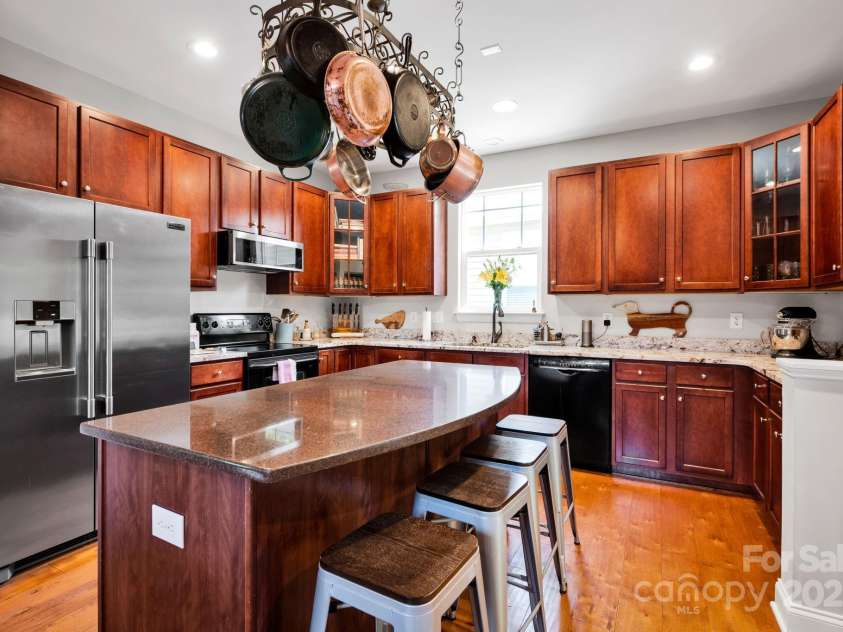 14940 Carbert Lane, Huntersville, NC 28078.  MLS# CAR4256086, YatesRealty ID 31763. Kitchen w/ new appliances, island, pot rack, granite counters