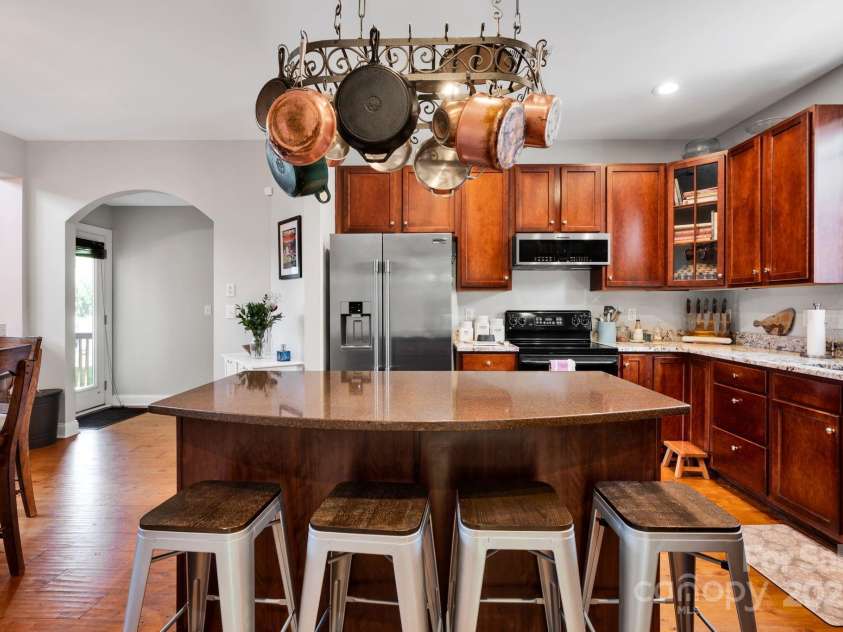 14940 Carbert Lane, Huntersville, NC 28078.  MLS# CAR4256086, YatesRealty ID 31763. Kitchen w/ new appliances, island, pot rack, granite counters