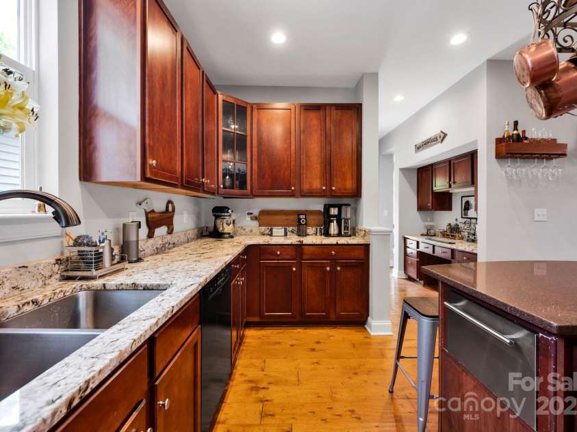 14940 Carbert Lane, Huntersville, NC 28078.  MLS# CAR4256086, YatesRealty ID 31763. Kitchen w/ new appliances, island, pot rack, granite counters