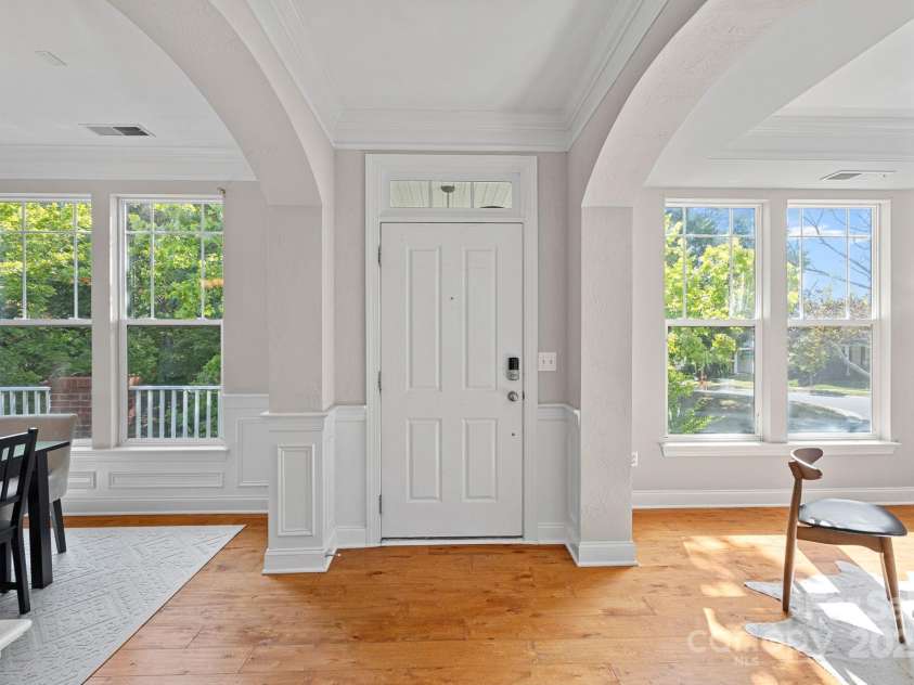 14940 Carbert Lane, Huntersville, NC 28078.  MLS# CAR4306108, YatesRealty ID 31763. Gorgeous archways in the foyer leading into the dining room and office or formal living room. Look at the wooded view from the front of the house!