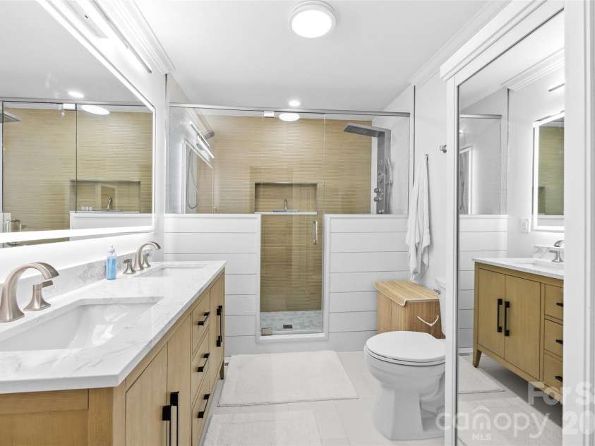 1263 Wendy Road, Rock Hill, SC 29732.  MLS# CAR4384169, YatesRealty ID 31766. Main floor primary Bathroom with Walk-in Tile Shower, Lighted Mirror, & Dual Sinks
