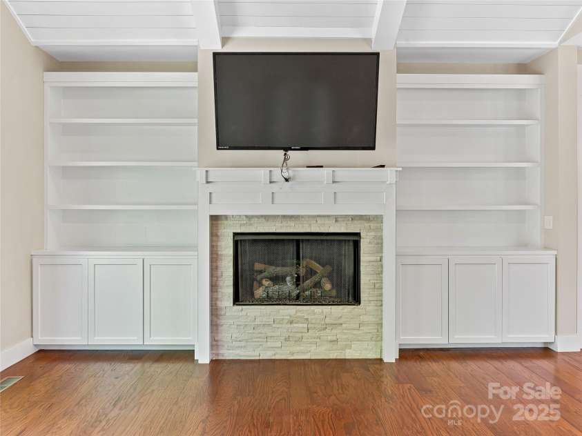 29 Farm Pond Lane, Candler, NC 28715.  MLS# CAR4258742, YatesRealty ID 31766. Gas log fireplace and entertainment area